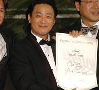 Park accepts his Grand Prix in Cannes, May 2004